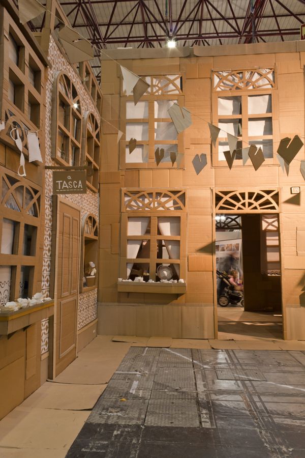 the inside of a building that is made out of cardboard and paper cutout shapes