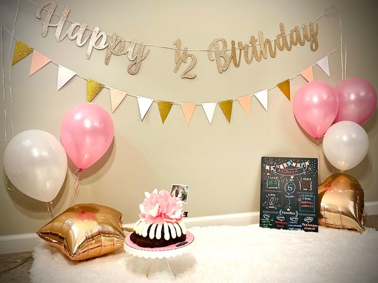 a birthday party with balloons, cake and decorations