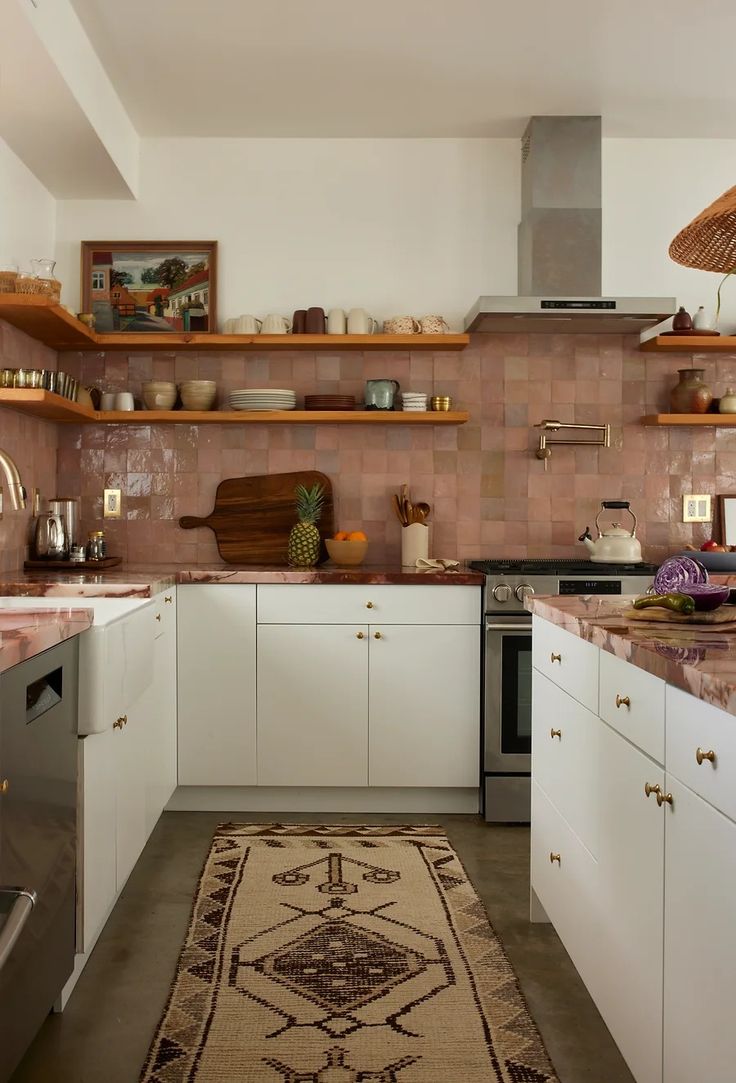 White cabinets, zellige tile backsplash, pink and red kitchen Minimal Boho Kitchen, Pink Zellige Tile, Red Tile Kitchen, Zellige Tile Backsplash, Architectural Digest Kitchen, Backsplash Kitchen White Cabinets, Red Backsplash, Marble Counters, Warm Kitchen