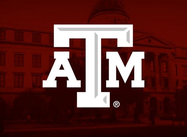 the texas a & m university logo is shown in front of a red building with white letters