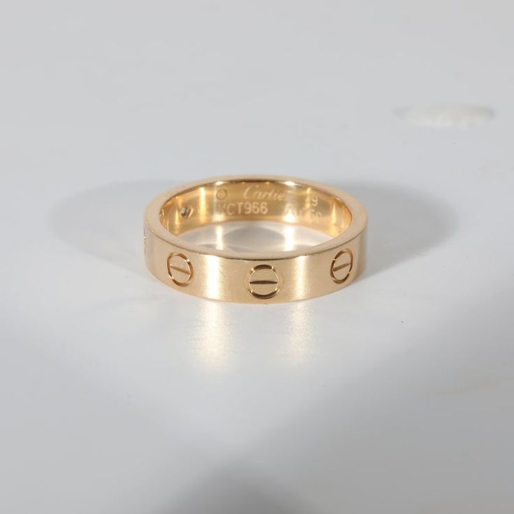 This is part of Chairish’s Fine Jewelry assortment.  Cartier Love Diamond Wedding Band With 1 Diamond in 18K Yellow Gold 0.02 CTW  PRIMARY DETAILS  SKU: 132486  Listing Title: Cartier Love Diamond Wedding Band With 1 Diamond in 18K Yellow Gold 0.02 CTW  Condition Description: Cartier's Love collection is the epitome of iconic, from the recognizable designs to the history behind the line-up. The collection started in 1969 with the bangle bracelet, which is engraved with a circular motif throughou Cartier Love Collection, Jewellery Wishlist, Cartier Love, Diamond Wedding Band, Diamond Wedding Bands, Diamond Wedding, Bangle Bracelet, Cartier, Ring Shopping