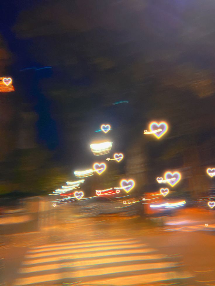 blurry photograph of street lights and hearts