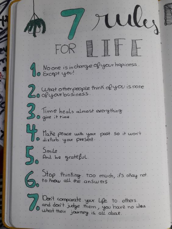 an open notebook with the words 7 rules for life written on it