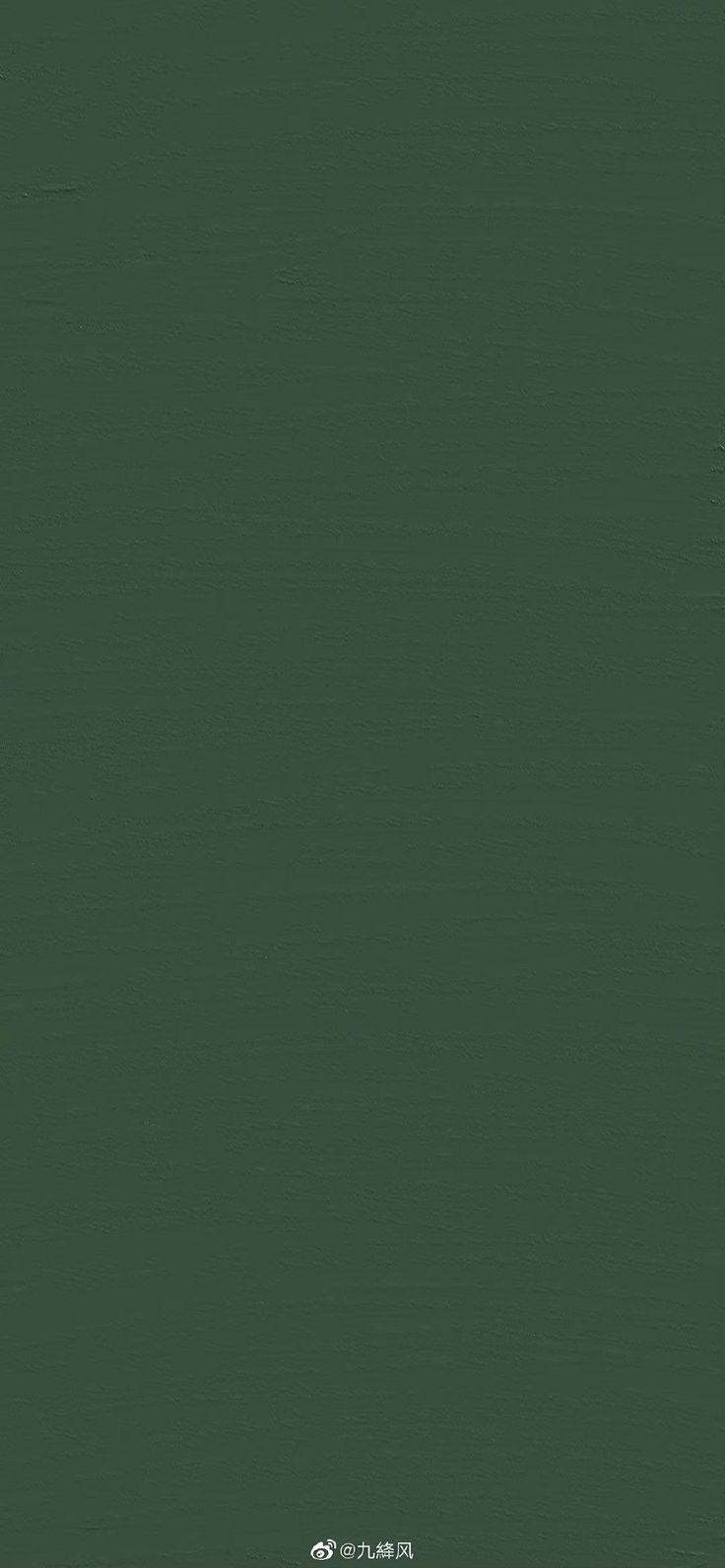 an image of a dark green background that looks like it could be used as a wallpaper