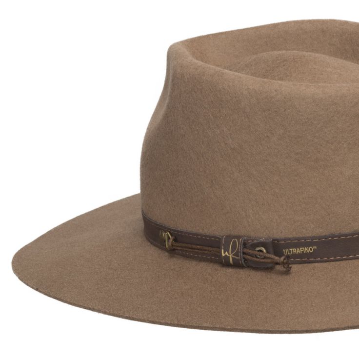 ↑ Click above to watch the video! ↑ Midtown is a sturdy wool fedora with a tall blocked teardrop crown that features a genuine leather hatband, a wide flat brim, and an adjustable sweatband. Perfect for your favorite fall outfit. Material: 100% WoolBrim: 3 1/2"Crown: 4 1/2 teardropHatband: 5/8 leatherClimate: Cold Hand-finished in the US. If your measurement falls between sizes, choose the next largest size. A looser fit is recommended as you can use hat size reducer tape to help nail the perfec Classic Leather Hat Bands For Fall, Fall Fedora With Fur Felt And Flat Crown, Classic Brown Felt Hat For Everyday, Leather Felt Hat With Flat Brim For Fall, Brown Winter Felt Hat For Everyday Wear, Brown Felt Hat For Everyday Winter Use, Everyday Brown Felt Hat For Winter, Brown Hat Bands For Everyday Fall Use, Leather Brimmed Felt Hat For Fall