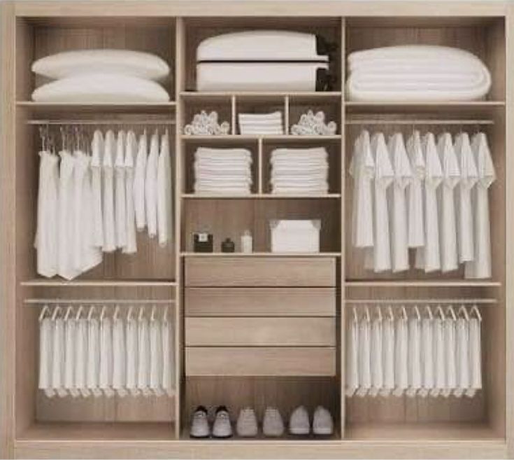 an organized closet with clothes and shoes