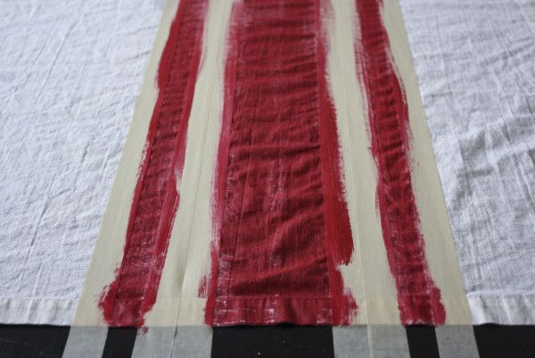 red and white stripes are painted on the fabric