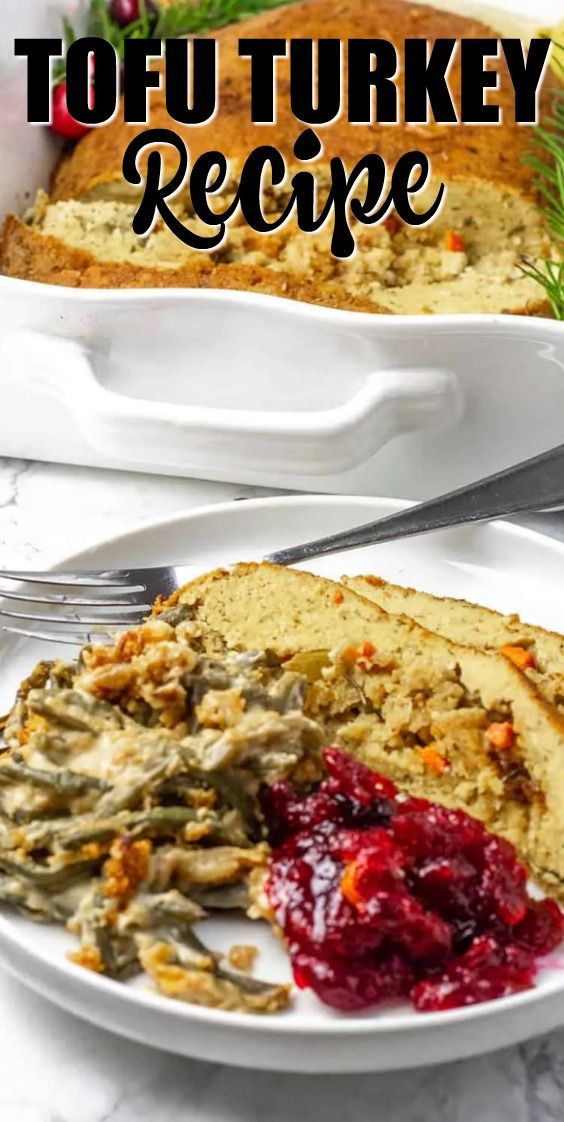 two plates with turkey and cranberry stuffing on them next to a loaf of bread