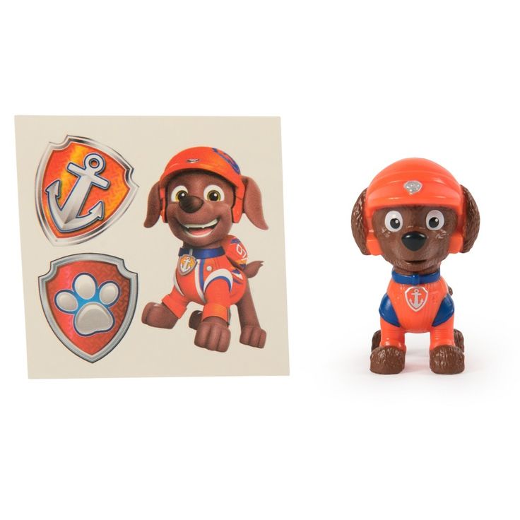 a small toy dog with an orange helmet and paw patrol sticker on it's back