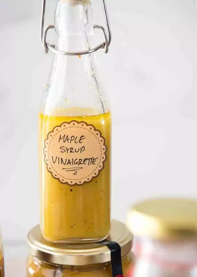 a glass bottle filled with liquid sitting on top of a table