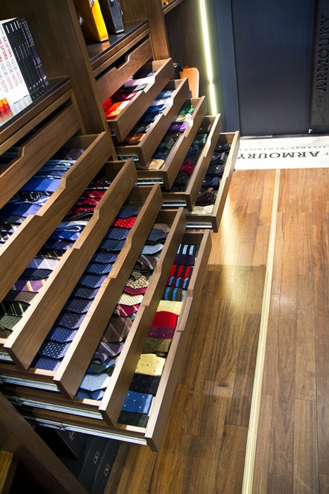 the drawers are full of socks and ties in this store's walk - in closet