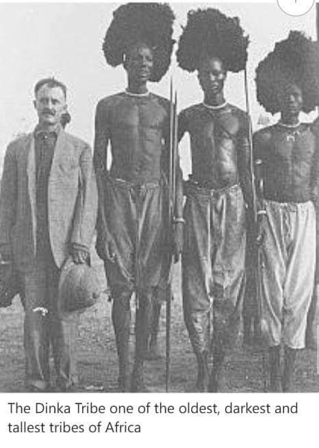 an old black and white photo of three men with afro hair standing next to each other