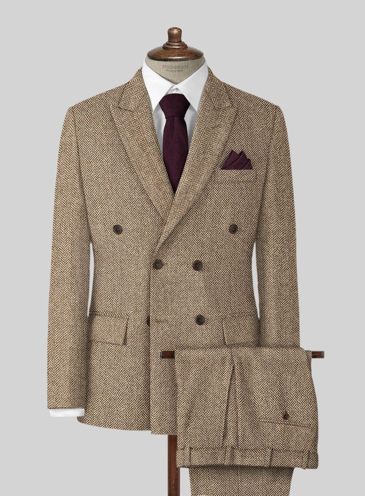 The Irish Brown Herringbone Tweed Suit will become the standard of business dressing and by far the most ubiquitous option. Crafted from wool, the Irish Brown color of the suit will surely influence a veteran dresser to buy the suit for building a sharp wardrobe. Team it up with a white shirt and dark brown derby shoes. 
 
 Look Includes  Irish Brown Herringbone Tweed Fabric  Double Breasted Jacket Style  Peak Lapel  Horn Brown Buttons  Single Vent  Three Cuff Buttons  Two Welted Back Pockets on Formal Tweed Suit With Suit Collar, Wool Suits With Herringbone Pattern And Suit Collar, Semi-formal Tweed Suit With Suit Collar, Wool Suits With Herringbone Pattern For Business Casual, Tailored Wool Suit With Herringbone Pattern, Tailored Wool Suits With Herringbone Pattern, Formal Tweed Three-piece Suit With Notch Lapel, Formal Three-piece Tweed Suit With Notch Lapel, Semi-formal Herringbone Tweed Jacket