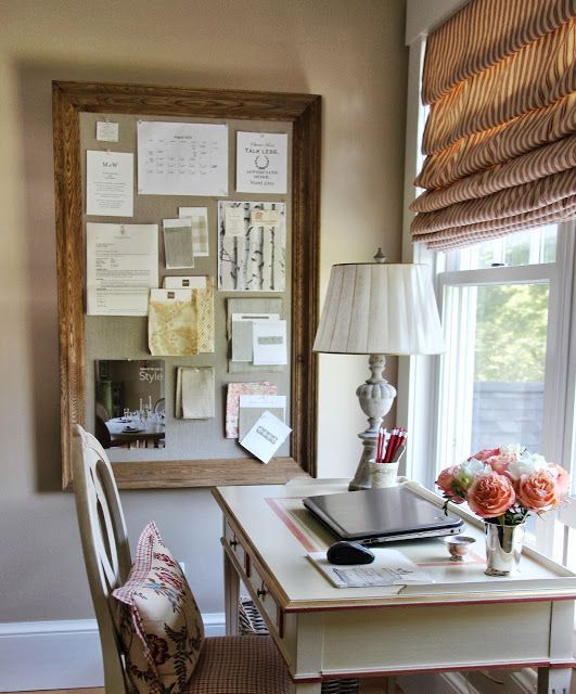 a desk and chair in front of a window