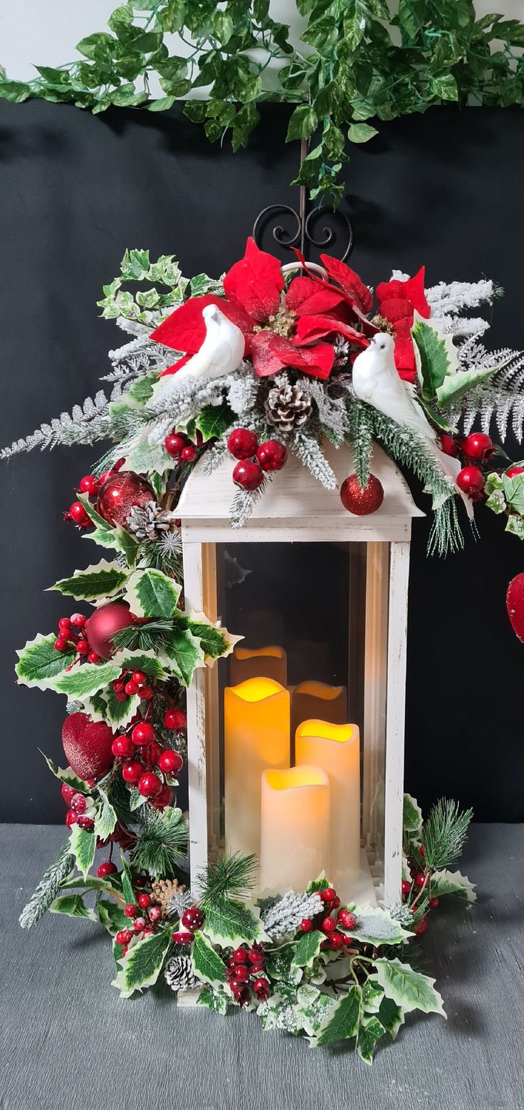 a christmas lantern with candles and decorations