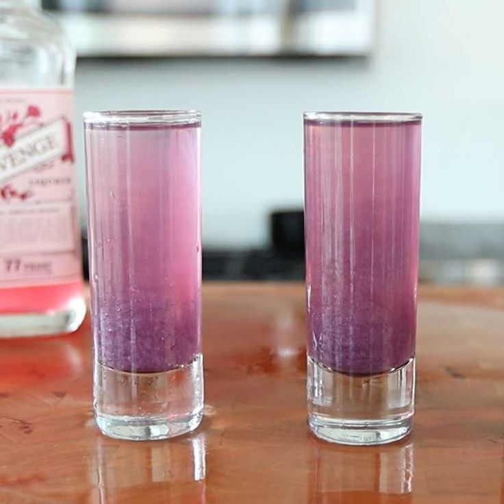 two glasses sitting on top of a wooden table