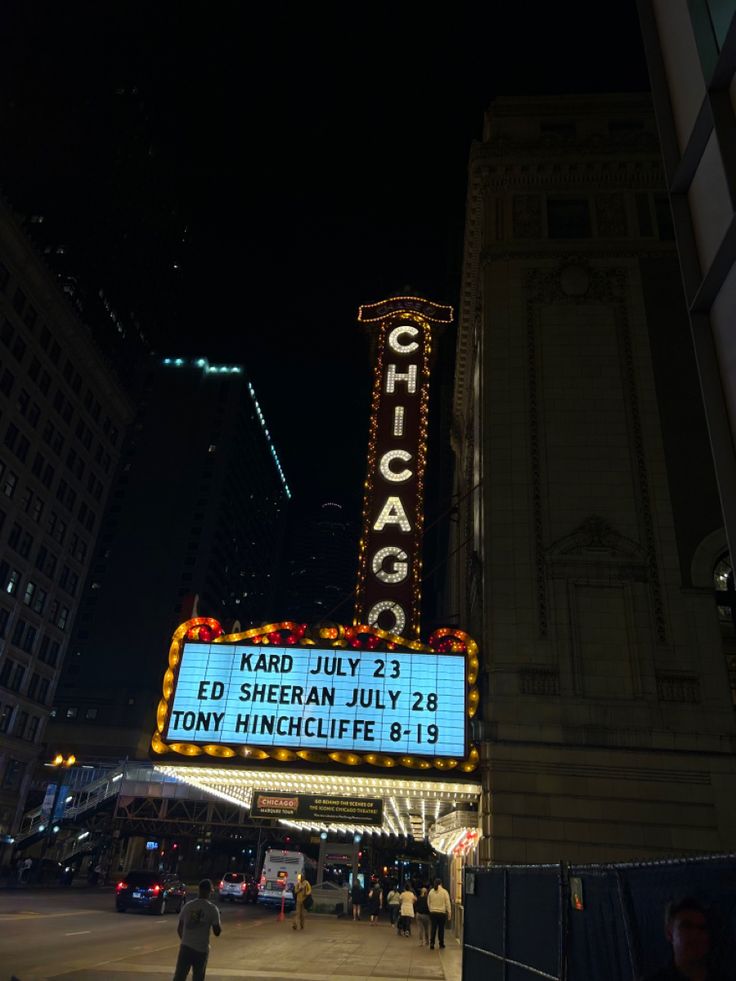 the chicago theatre marquee is lit up at night