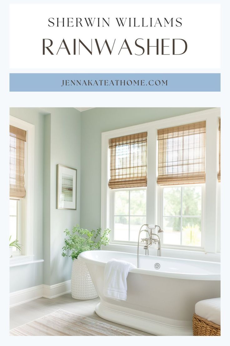 a white bath tub sitting under two windows next to a sink and window sill