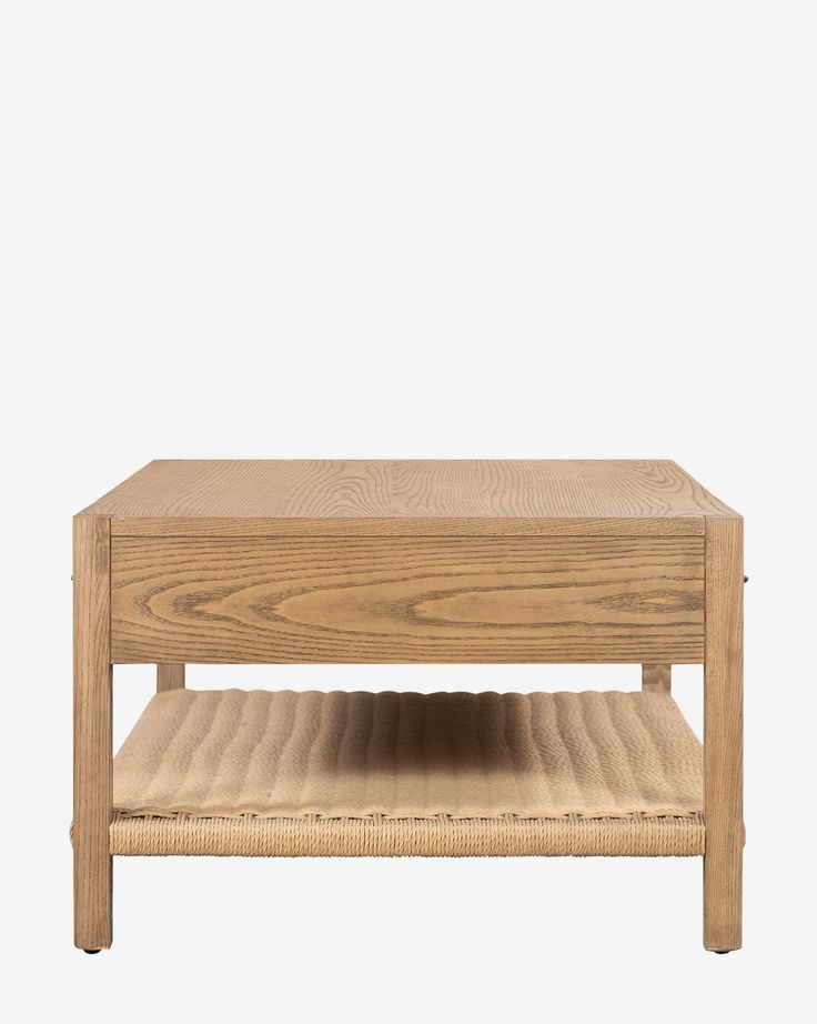 a wooden coffee table sitting on top of a white wall