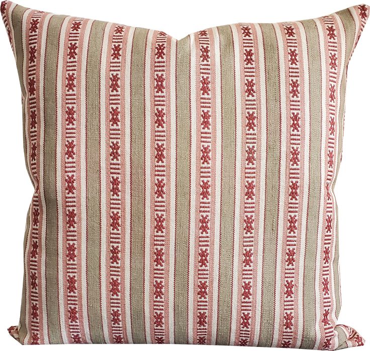 a red and white striped pillow with an intricate design on the front, sitting on a white background