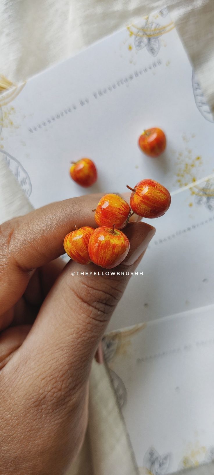 a person is holding some fruit in their hand and it looks like they have been picked from the tree