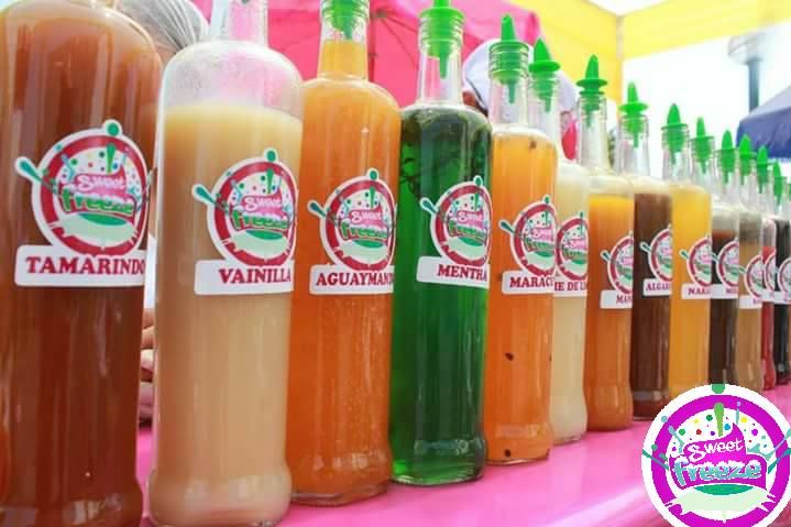 several bottles of liquid are lined up on a table