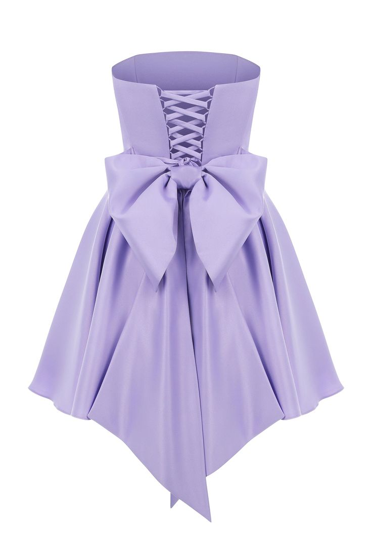 Introducing the Emily Dress with Bow: a stunning mini satin dress in a beautiful lilac color, designed to make you stand out. This dress features a dramatic maxi bow at the lower back, adding a bold and stylish touch that is perfect for girls who love to make a statement. The Emily Dress is not only eye-catching but also offers an impeccable fit with adjustable lacing at the back, ensuring you feel comfortable and confident throughout your special event. The elegant lilac hue enhances its sophis Formal A-line Dress With Satin Bow, Elegant Mini Dress With Bow Tie Back For Bridesmaid, Spring Gala Dress With Tie Back, A-line Mini Dress With Bow For Prom, Lavender Dresses For Prom Season, Spring Prom Mini Dress With Bow, Satin Dress With Detachable Bow For Prom, Satin A-line Dress With Bow, Fitted Purple Dress With Tie Back