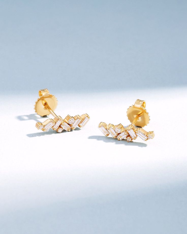 Crafted with 18-karat gold, these elegant baguette diamond studs bring a touch of sophistication to any ensemble. Perfect as a stylish update to your jewelry collection or as a meaningful gift. Details 18k yellow gold, rose gold or white gold 0.60 carats of baguette and round white diamonds 15x5mm dimensions Ref: BAE555 Elegant Yellow Gold Diamond Earrings With Baguette Diamonds, Elegant Gold Diamond Earrings With Baguette Diamonds, Elegant Gold Diamond Earrings With Baguettes, Yellow Gold Diamond Earrings With Baguette Diamonds, Classic Gold Diamond Earrings With Baguette Diamonds, Classic Gold Diamond Earrings With Baguettes, Gold Baguette Cut Diamond Earrings With Accents, Rose Gold Baguette Diamond Earrings For Anniversary, Classic Gold Baguette Diamond Earrings