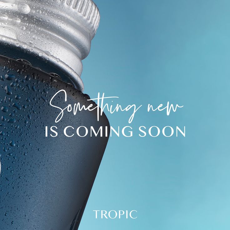 a close up of a water bottle with the words something new is coming soon