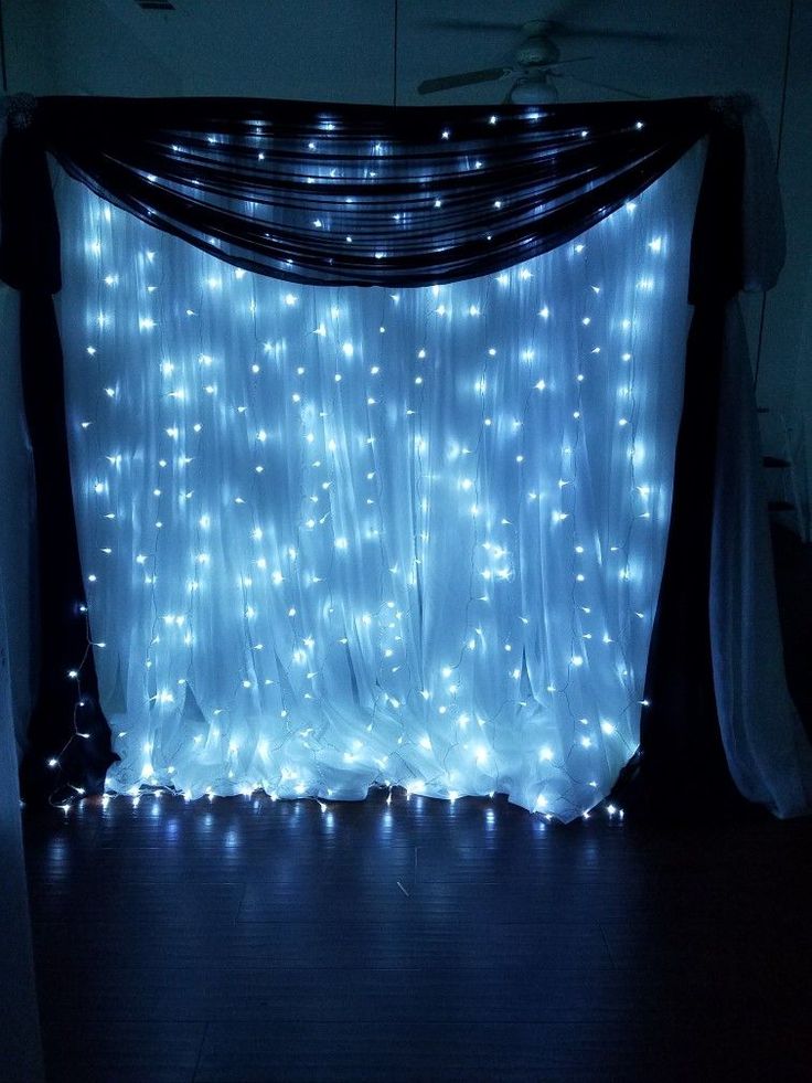 a curtain with lights on it in the dark