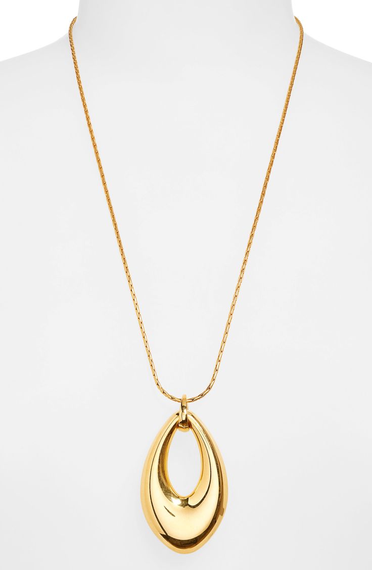 A surprisingly lightweight sculptural loop pendant swings from a generous chain on this gleaming necklace. 24 1/4" length; 1 7/8" extender; 1/2"W x 2 1/2"L pendant Lobster clasp closure Goldtone plate Imported Modern Gold-tone Oval Link Necklaces, Modern Gold-tone Necklaces With Cable Chain, Gold-tone Necklace With Detachable Pendant For Formal Occasions, Modern Gold-tone Necklace With Cable Chain, Modern Long Necklace For Evening, Modern Teardrop Pendant Necklace, Gold-tone Chain Necklace With Detachable Pendant, Modern Pendant Necklace With Detachable Pendant, Modern Adjustable Chain Necklace With Pendant