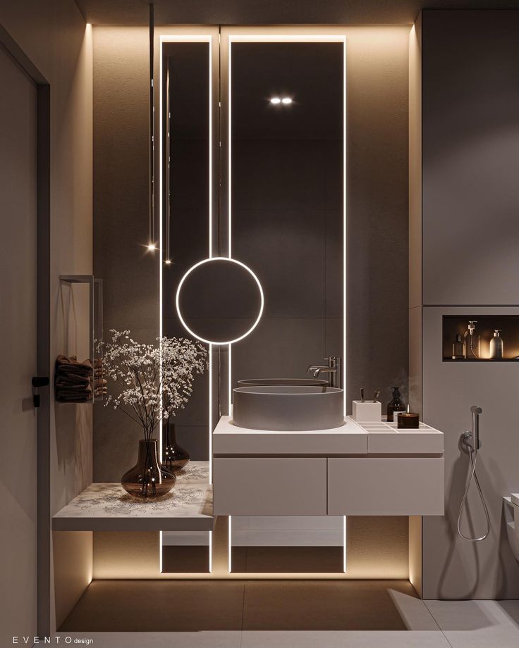 a bathroom with a sink, mirror and lights on the wall above it's counter