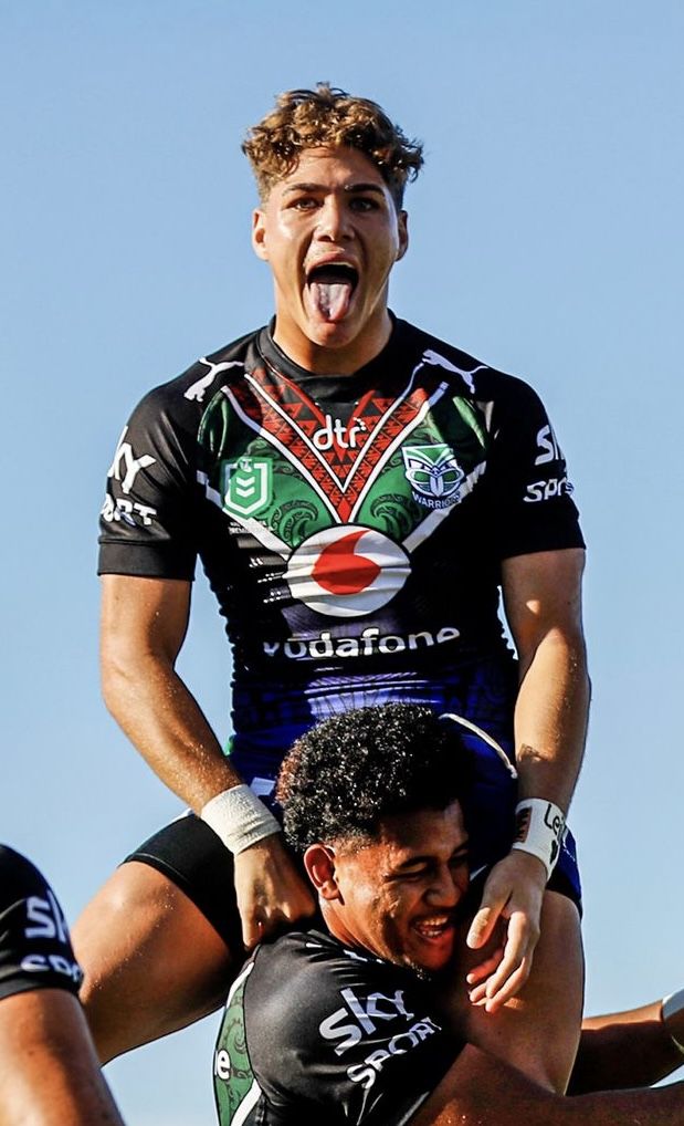 a rugby player is being lifted by his team mates