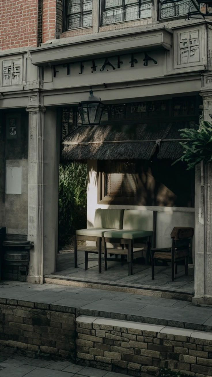 the outside of a restaurant with tables and chairs