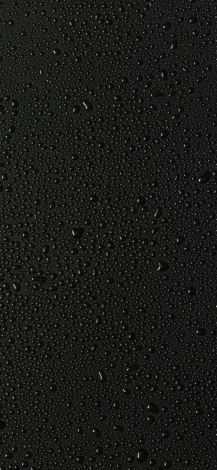 water drops on the surface of black material