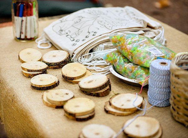 the table is covered with wood slices and crochet hooks for sewing threading