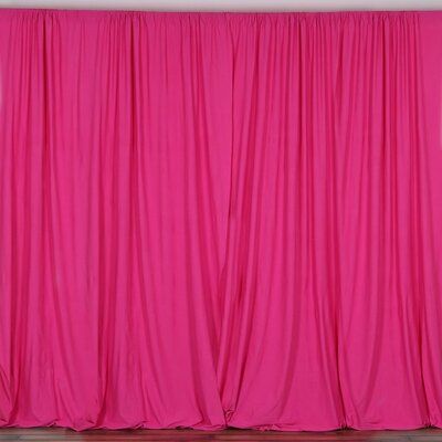 the pink curtains are closed up and ready to be used as backdrop for an event