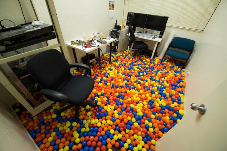 an office with balls all over the floor