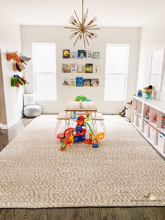 a child's playroom with toys on the floor