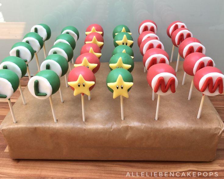 there are many cake pops with different designs on them