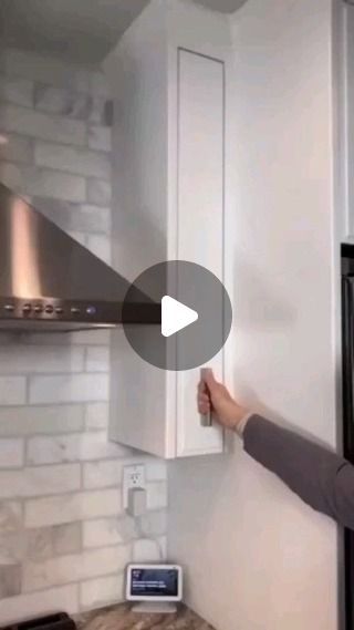 a woman is opening the refrigerator door