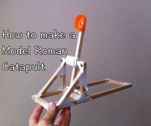 a hand holding a model roman catapult with the words how to make a model roman catapult