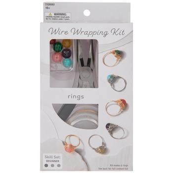 an assortment of rings in a package with the words wire wrapping kit written on it