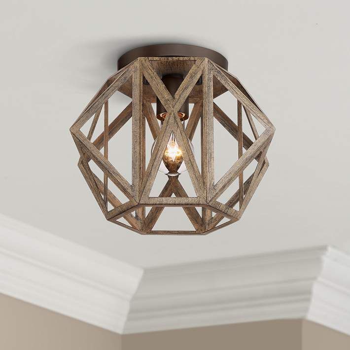 a wooden light fixture hanging from the ceiling