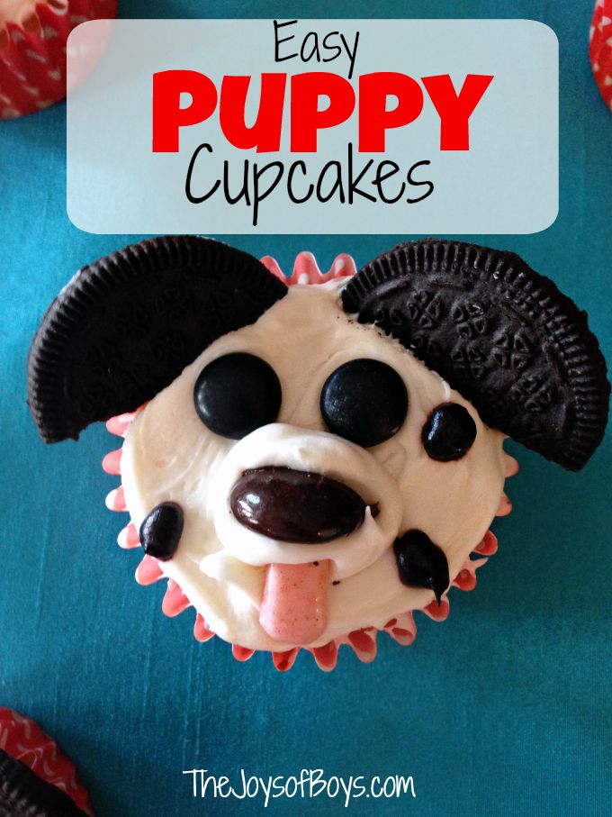 an easy puppy cupcake is decorated with white frosting and chocolate chips on top