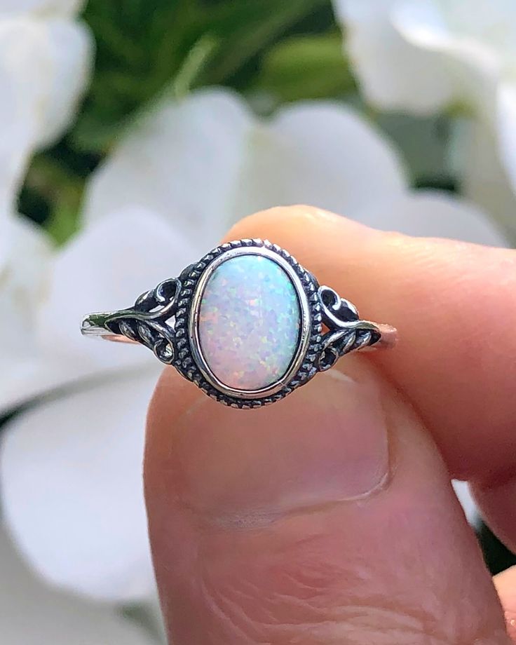 Sterling Silver Oval White Lab Opal Ring | The Life Divine Sterling Silver Oval White Lab Opal RingCherished for its brilliance, Opal is known as a stone of creativity and vitality. Opal is also a reflective stone of protection, absorbing energies and sending them back to their source.Measures approximately 3/8" H x 1/2" W Adjustable Oval Spiritual Rings, Adjustable Opal Crystal Ring, Oval Shape, Adjustable Opal Oval Crystal Ring, Adjustable Oval Opal Crystal Ring, White Oval Opal Crystal Ring, Adjustable White Oval Crystal Ring, Spiritual Oval Opal Birthstone Ring, Spiritual Oval Rings For Anniversary, Silver Opal Oval Crystal Ring