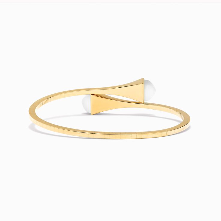 18 Karat Yellow Gold Slip-On Bracelet This distinctive design features a bracelet crafted from 18K white, rose, or yellow gold, and capped with precious gemstones of your choice for an iconic statement look. It can be worn alone or layered with other pieces of the collection for a fashion-forward look. Cleo by Marli draws inspiration from Cleopatra, evoking her strength and power capturing enriching color and daring design. Luxury Oyster Bracelet For Anniversary, Modern Gold Plated Bangle Bracelets, Yellow Gold Oyster Bracelet For Everyday Luxury, Luxury 14k Gold Oyster-style Bracelet, Luxury 14k Gold Oyster Bracelet, Luxury Yellow Gold Oyster Bracelet, Modern Gold-plated Yellow Gold Cuff Bracelet, Modern Gold Plated Jewelry With Bracelet Strap, Modern Yellow Gold-plated Cuff Bracelet