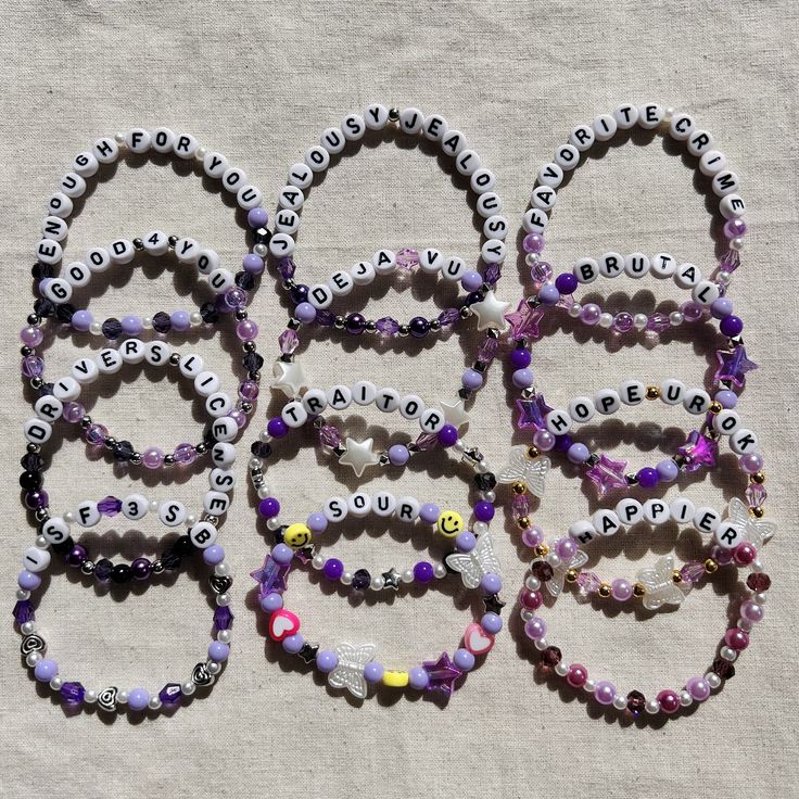 Beaded bracelets that can be traded at the GUTS Tour. All bracelets are approximately 7 inches. If you would like your bracelet to be made a different size please let us know. Colors may vary slightly. To persevere bracelets, please avoid overstretching. Avoid water, to persevere bead coloring. We are not responsible for broken bracelets after they are in your care. Personalized Purple Wristband For Friendship, Customized Purple Bracelets For Friendship, Personalized Purple Charm Bracelet For Friendship, Purple Friendship Bracelets With Letter Beads, Customized Purple Friendship Bracelets, Customized Trendy Purple Beaded Bracelets, Customized Purple Jewelry For Friendship, Customizable Purple Jewelry For Friendship, Trendy Personalized Purple Bracelets