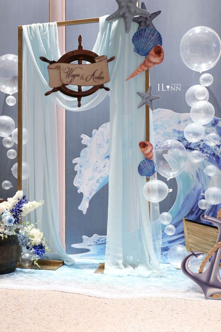 an ocean themed backdrop for a baby shower