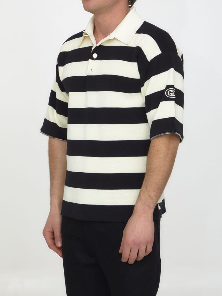 Ivory and black striped knit cotton polo with detachable zipped sleeves. It features pointed collar, front buttoned placket and GG patch on left sleeve. The model is 188cm tall and wears size M. Size nationality: INTGender: MenMaterial: 100% COTTONColor: BeigeMade in: ITProduct ID: 4273612 724708 XKCV0 9207*Import tax/duty will be calculated at checkout (If applicable) Classic Striped Polo Sweater With Ribbed Collar, Casual Black Polo Sweater With Striped Collar, Classic Striped Polo Sweater With Polo Collar, Classic Collared Polo Sweater With Contrast Stripes, Gucci Cotton Short Sleeve Polo Shirt, Gucci Cotton Polo Shirt, Gucci Casual Collared Polo Shirt, Casual Gucci Collared Polo Shirt, Casual Gucci Polo Shirt